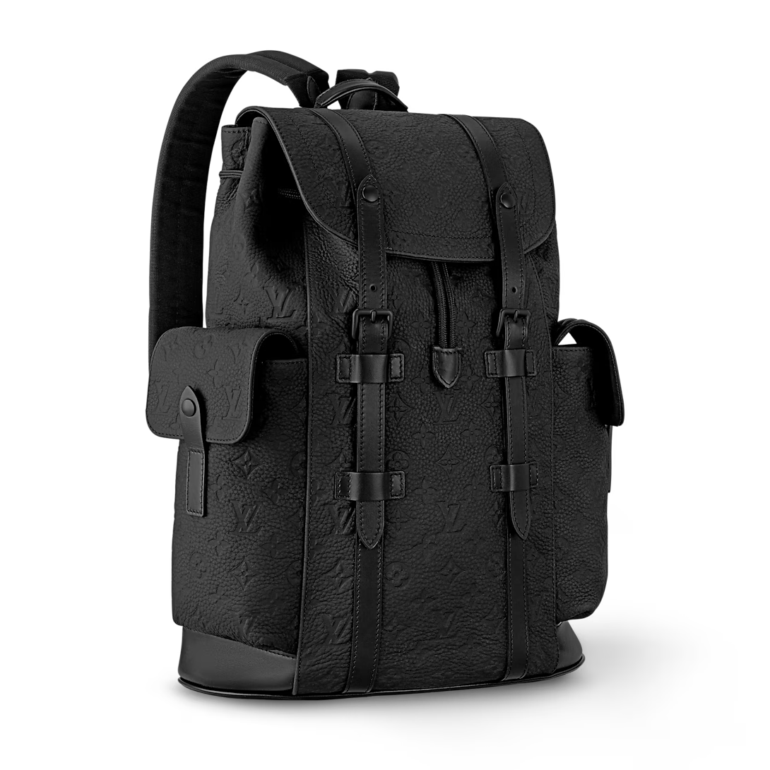 Black textured backpack with leather straps on a white background