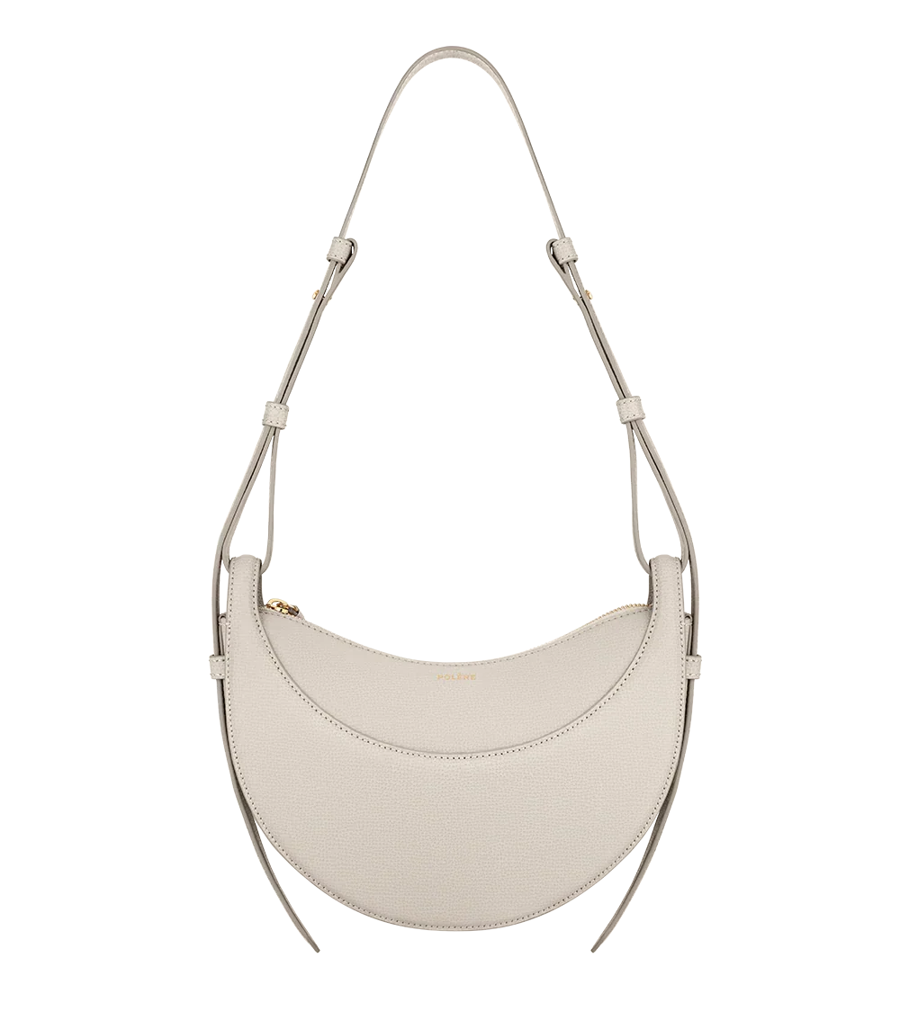 Elegant white leather shoulder bag with adjustable strap, displayed on Icon Kart Shop